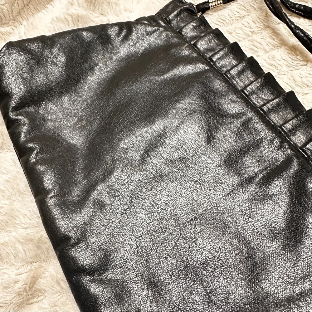 Vintage Chic Black Leather Clutch with strap, Metal inside makes diamond opening